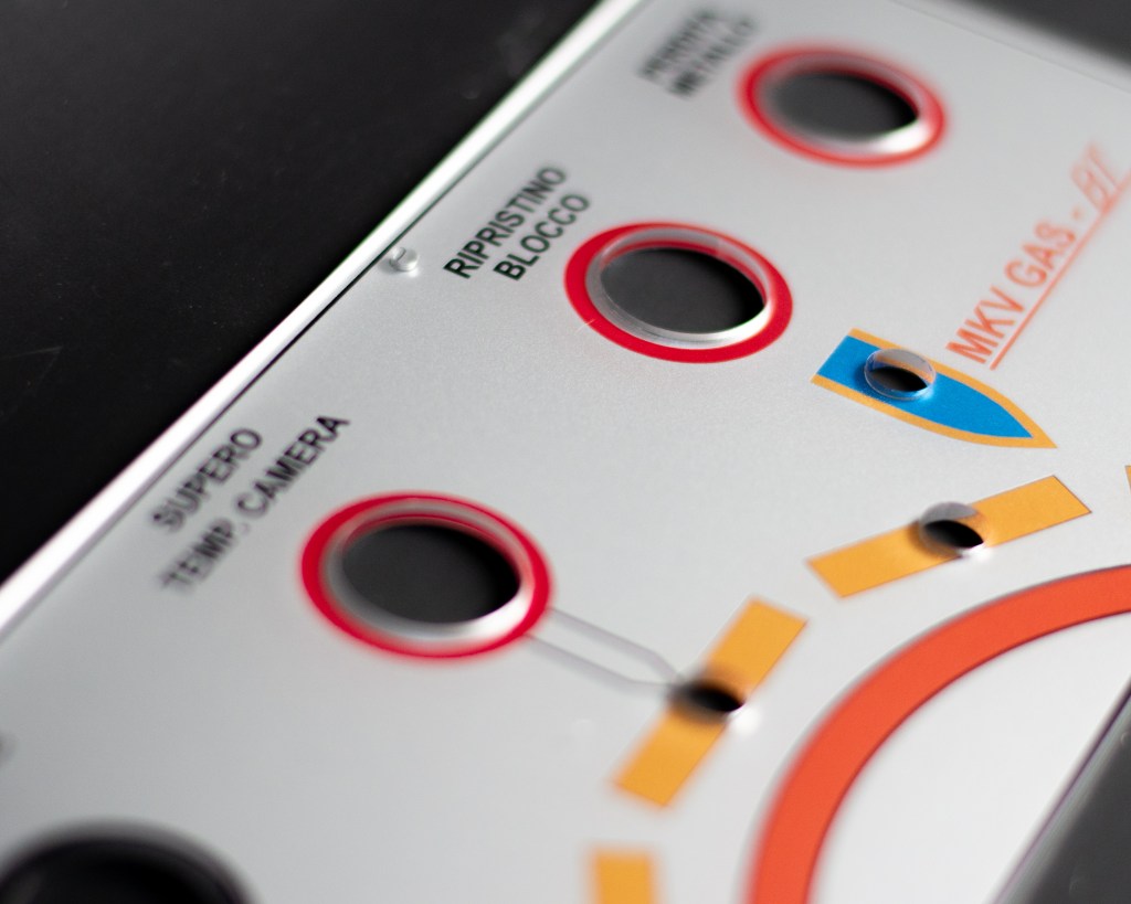 Close up image of a control panel which has been UV printed on the reverse in full colour with a silver vinyl 